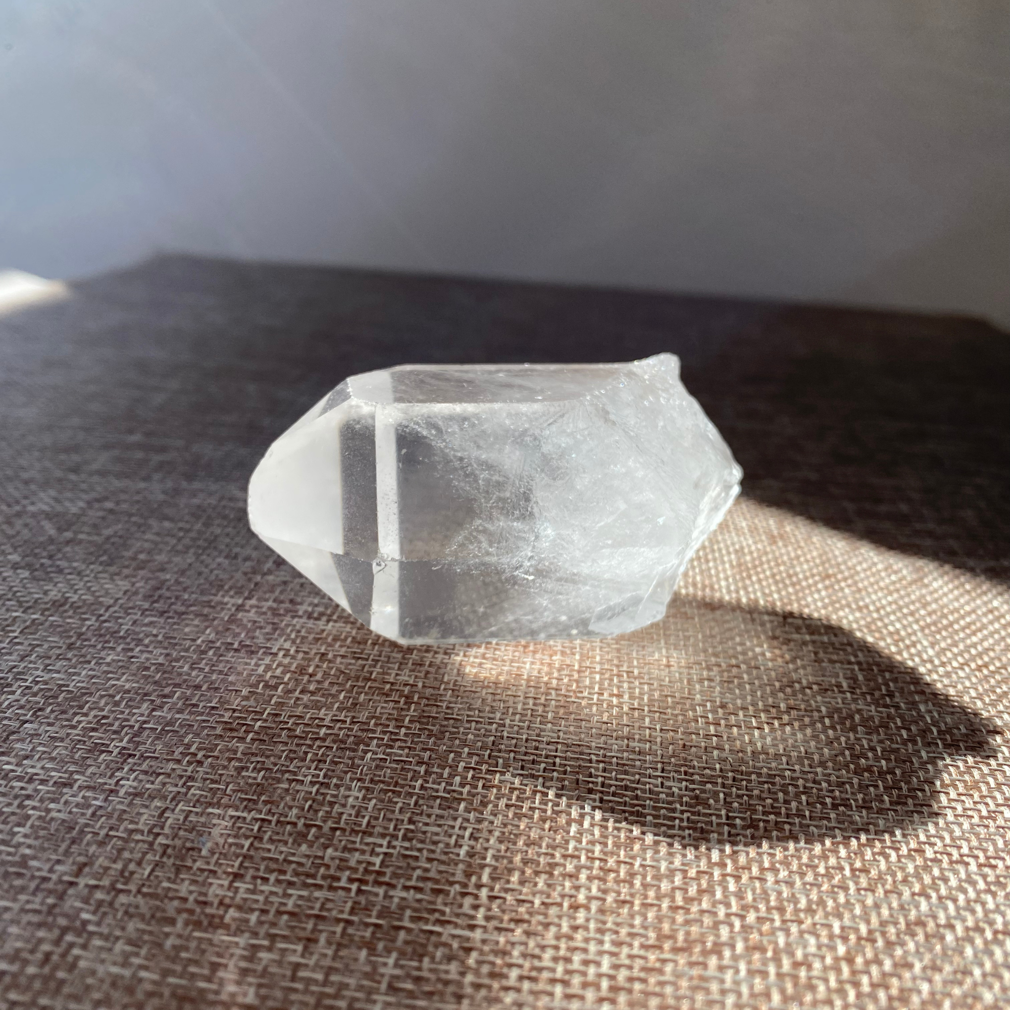 A raw Clear Quartz point chosen to support clarity, focus, and energy amplification.