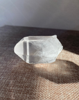 A raw Clear Quartz point chosen to support clarity, focus, and energy amplification.