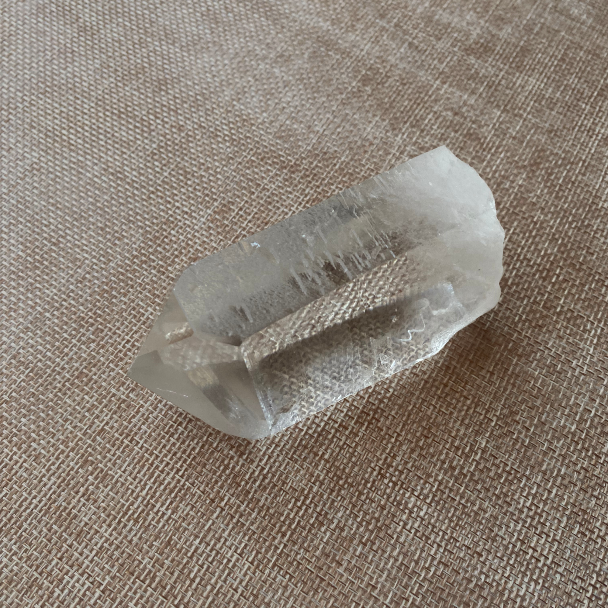 Clear Quartz Point with a Subtle Smoky Hue.