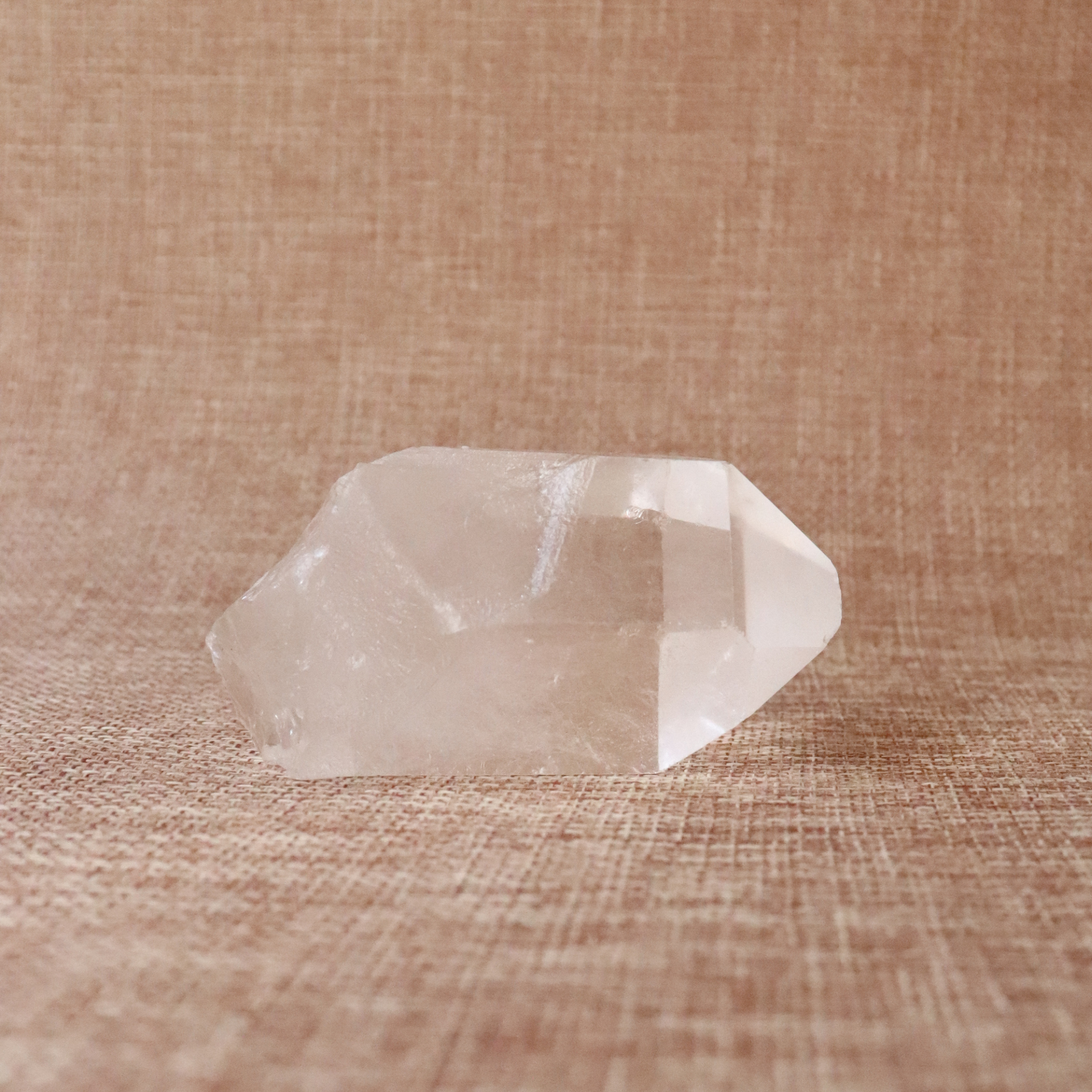 A raw Clear Quartz point chosen to support clarity, focus, and energy amplification.