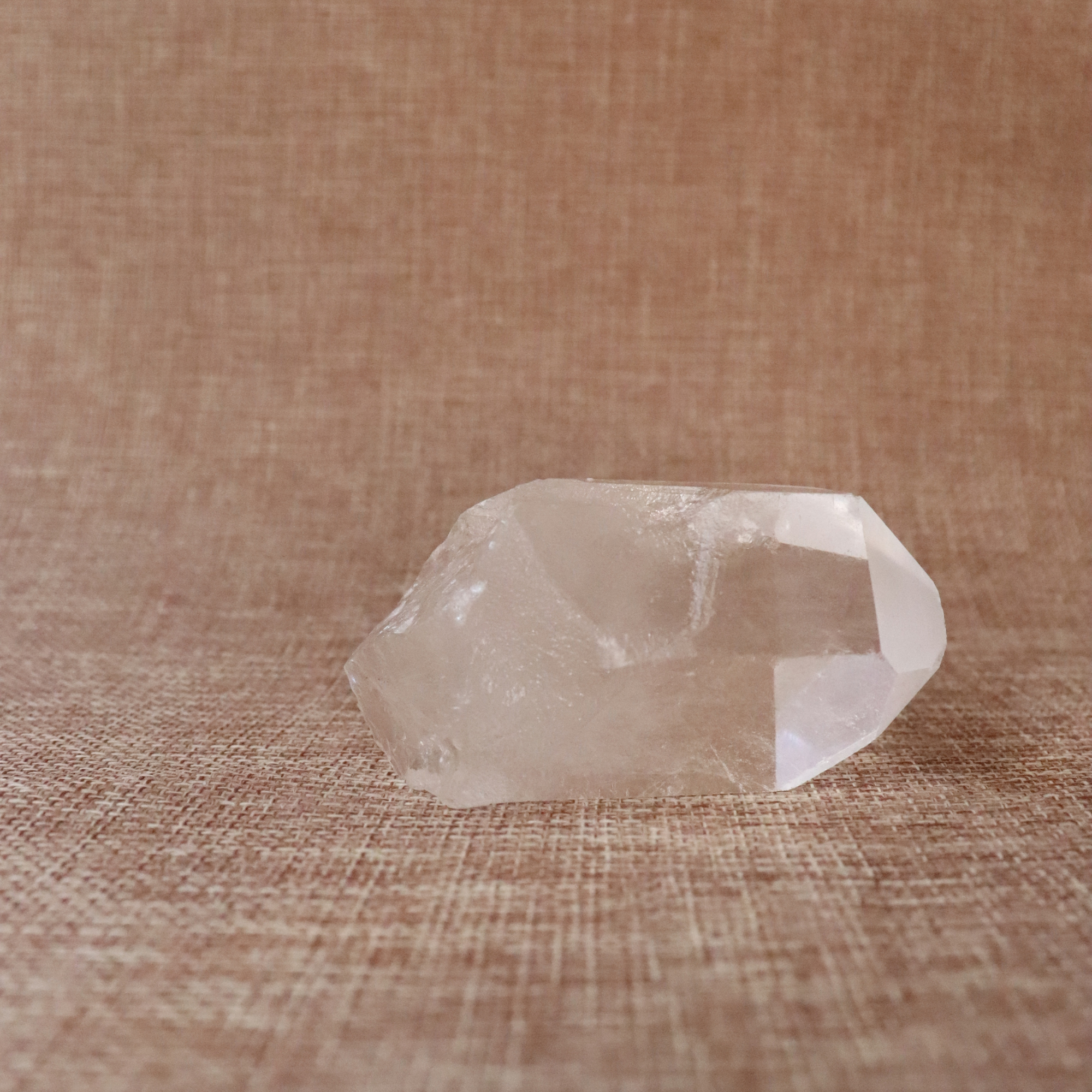 A raw Clear Quartz point chosen to support clarity, focus, and energy amplification.
